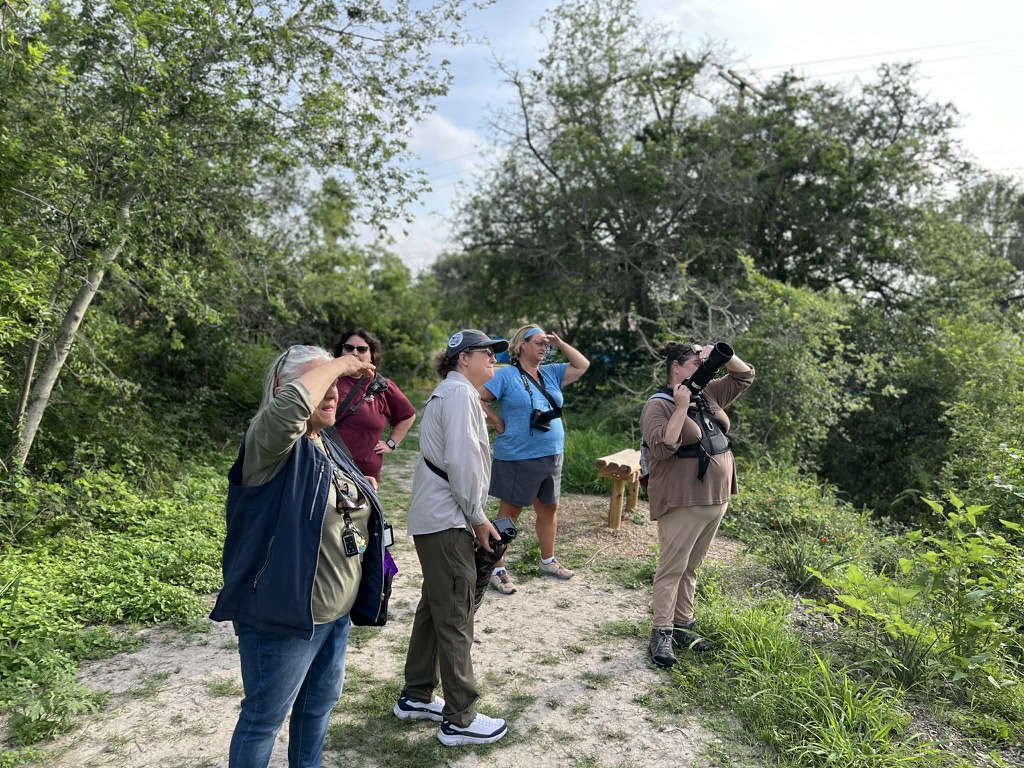 Bird photography workshop participants learning field techniques in a group setting